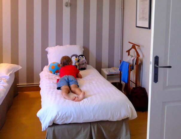 Image showing kids bedroom with kid reading a book.