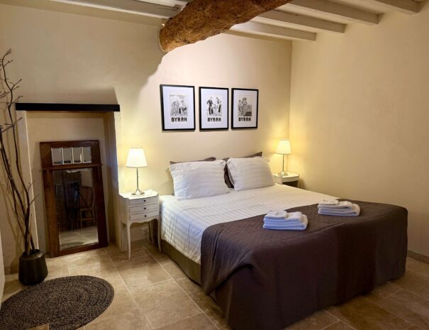 Image showing master bedroom in Gite Malepere "Bas" at Domaine de la Bade, a holiday rental in South France, for couples and families seeking a comfortable and peaceful place to stay.